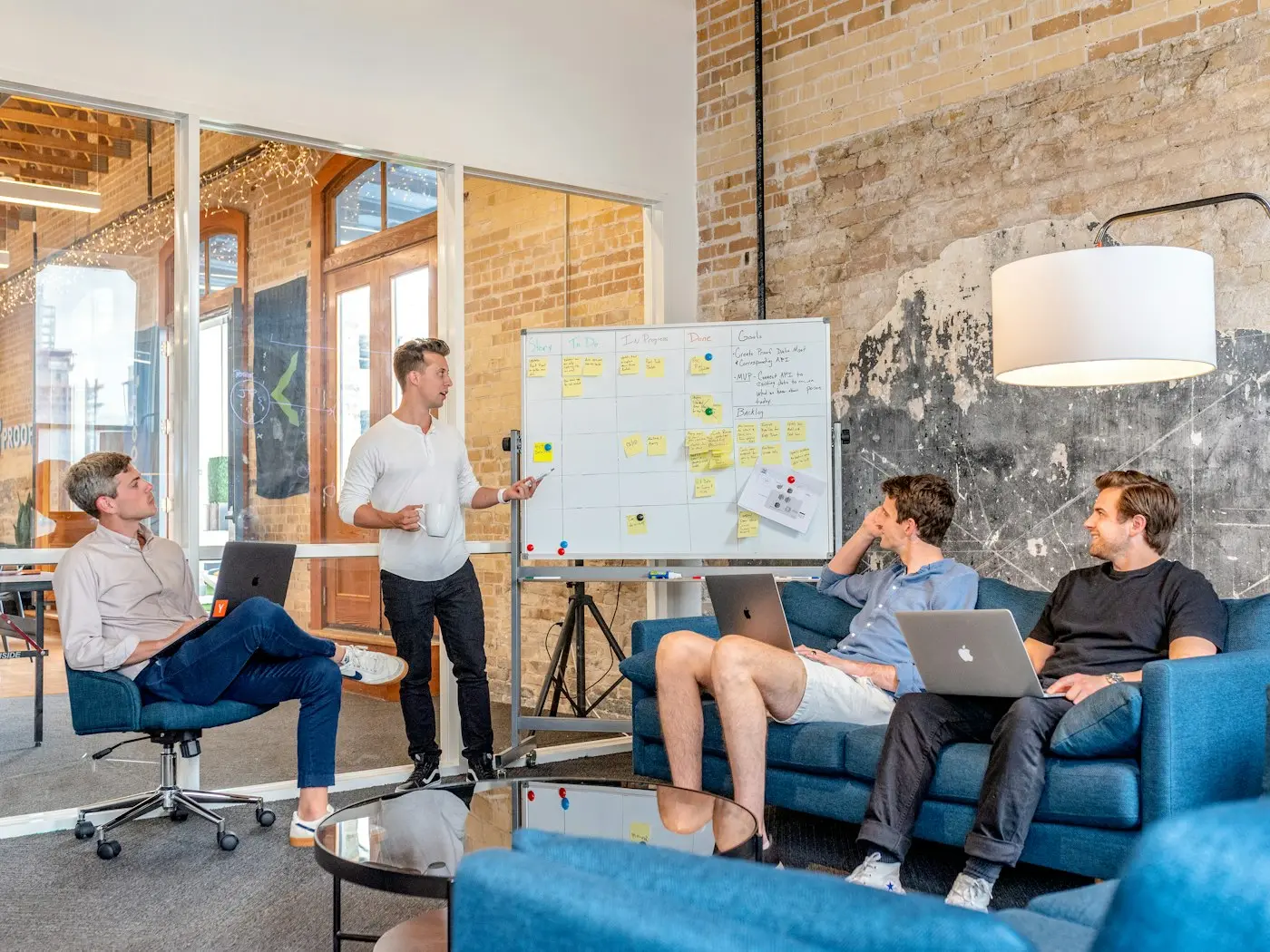 Marketing team planning a strategy together at a whiteboard